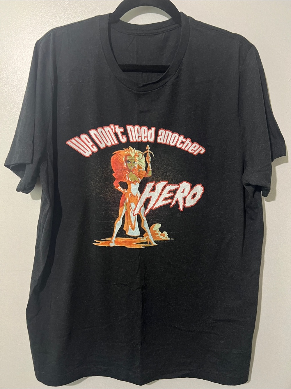 Black Graphic Short-Sleeve Tee with 'We Don't Need Another Hero' Print